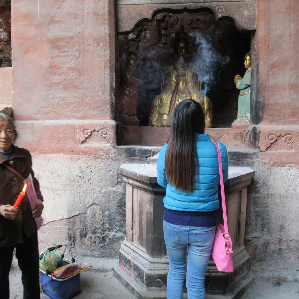 Incense sticks are offered to the deities