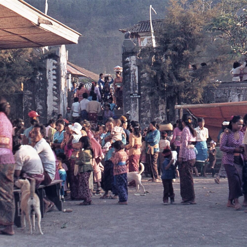 The people of the village slowly enter the temple